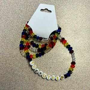 PRIDE They/Them pronoun rainbow belly chains
Medium size clear rainbow beads